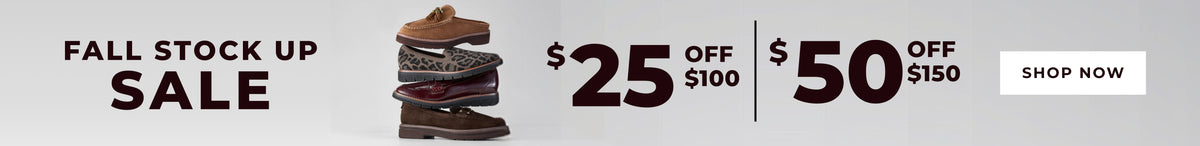A promotional banner for a fall stock up sale, featuring a stack of brown leather boots in the center, with text offering $25 off $100 and $50 off $150, plus a 'SHOP NOW' button on a light gray background.